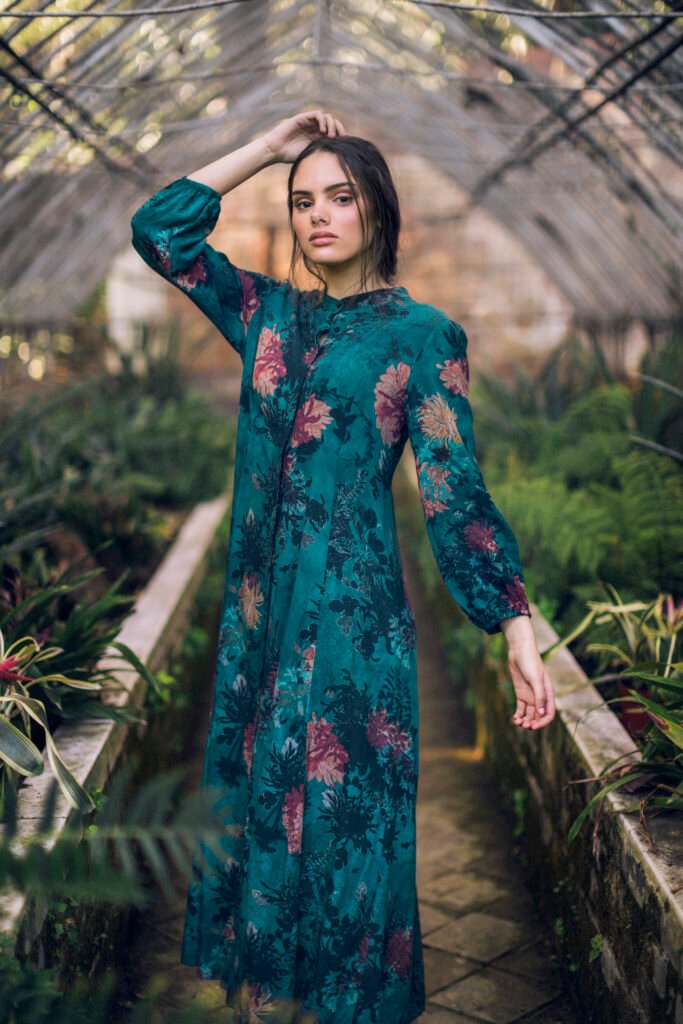 Woman Blue Floral Dress Looking Camera